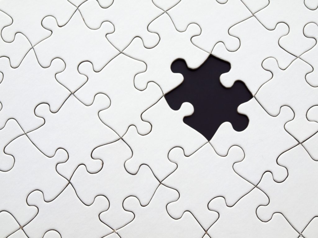 white puzzle with one missing piece