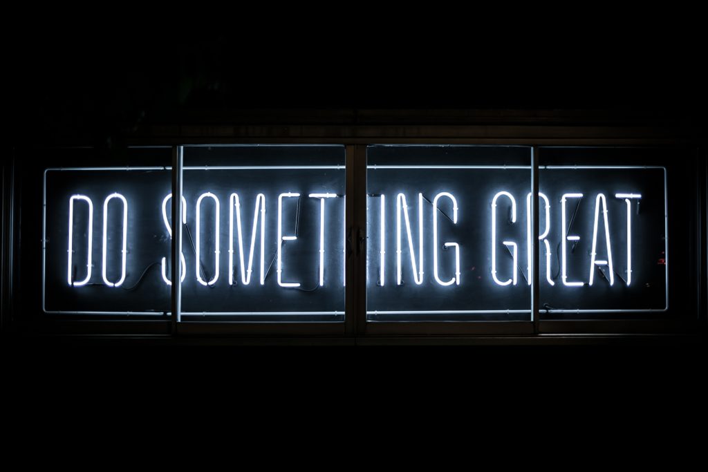 Neon sign that says "Do something great"
