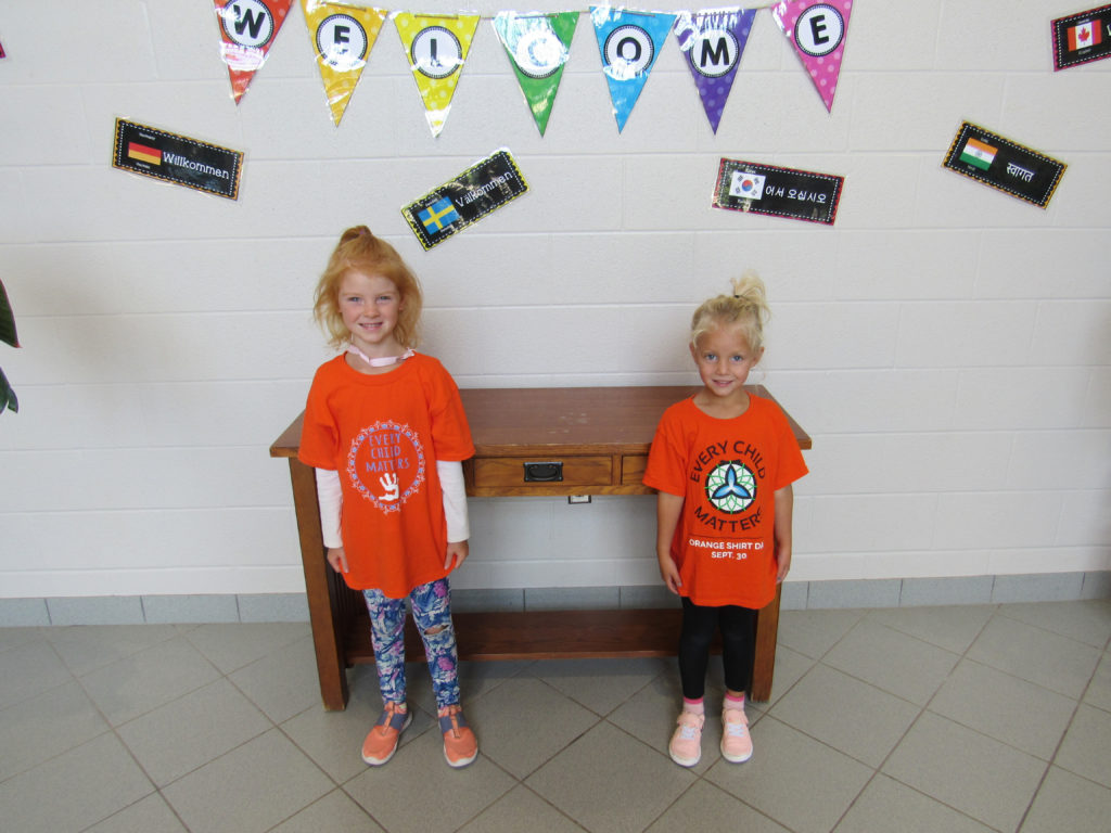 2 kids wearing orange shirts for truth and reconciliation day